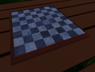 An empty chess board on a table.